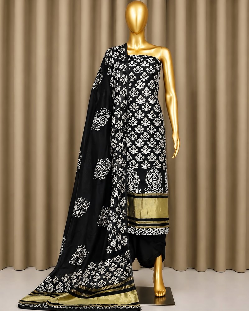 Black ladies dress piece with white floral print and gold-bordered dupatta